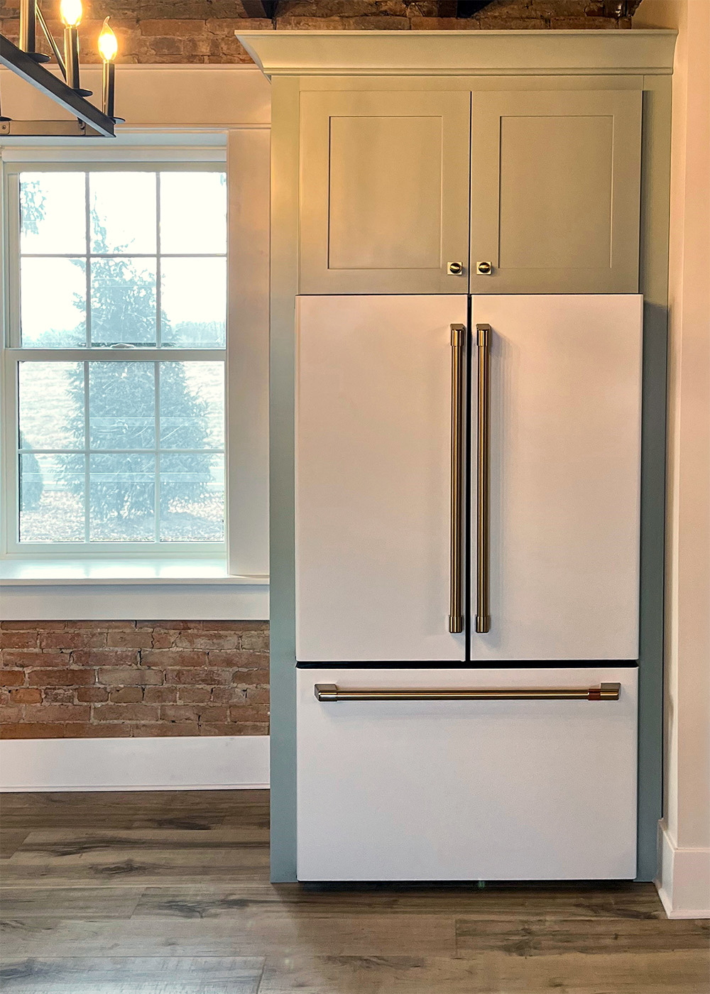 GE Cafe refrigerator A kitchen designed with GE Café Appliances